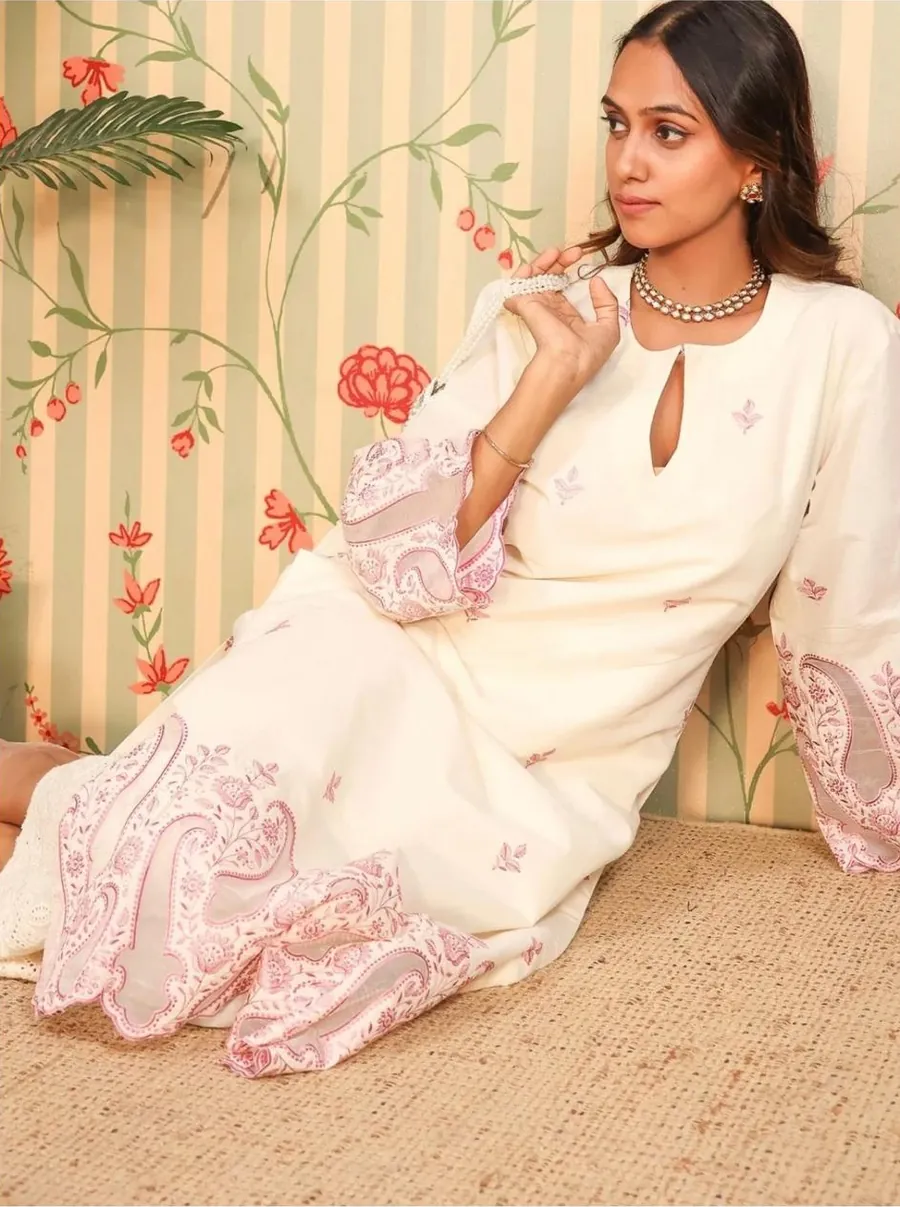 Aanchal seated in the ivory embroidered kurta set