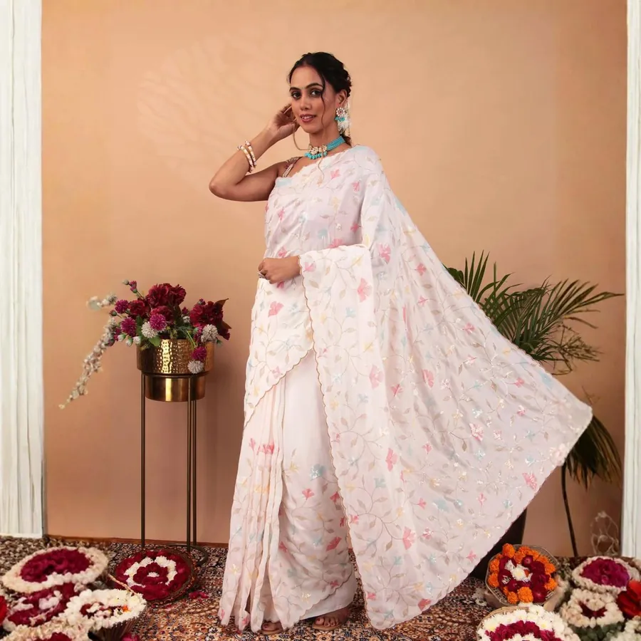 Aanchal in a white printed saree, pallu in motion