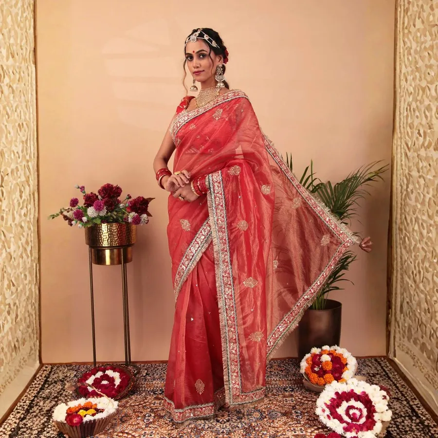 Aanchal in the coral saree, three-quarter view