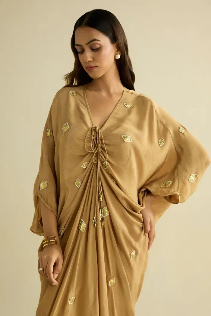 Aanchal in a gold draped kaftan by Meesa